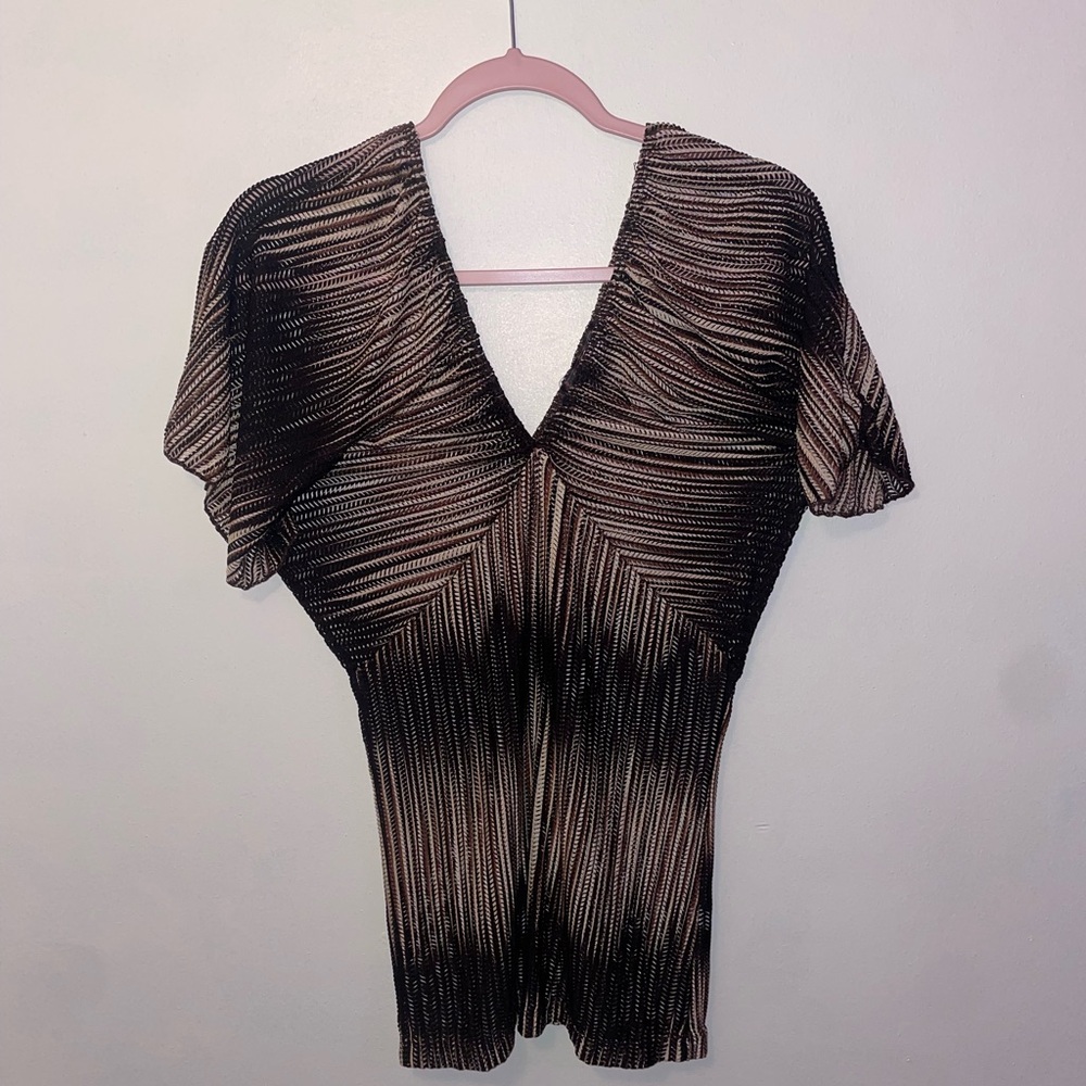 LIPSTICK CREAM AND BLACK BATHING SUIT COVER UP